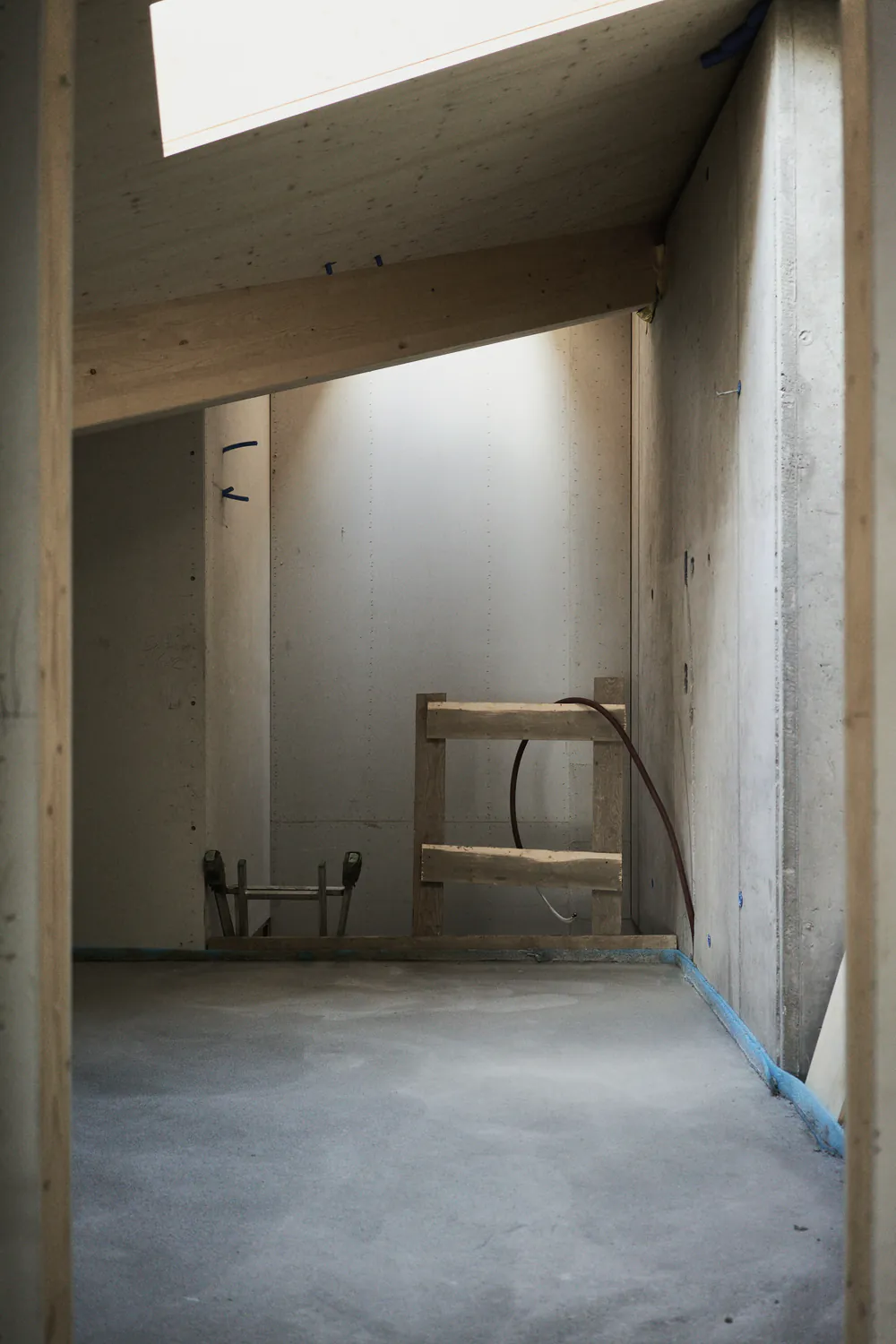 A room at lock up with a concrete floor and new walls